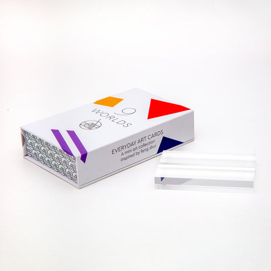 Wellness and oracle deck called 9 Worlds made by Everyday Art Cards with lucite stand.