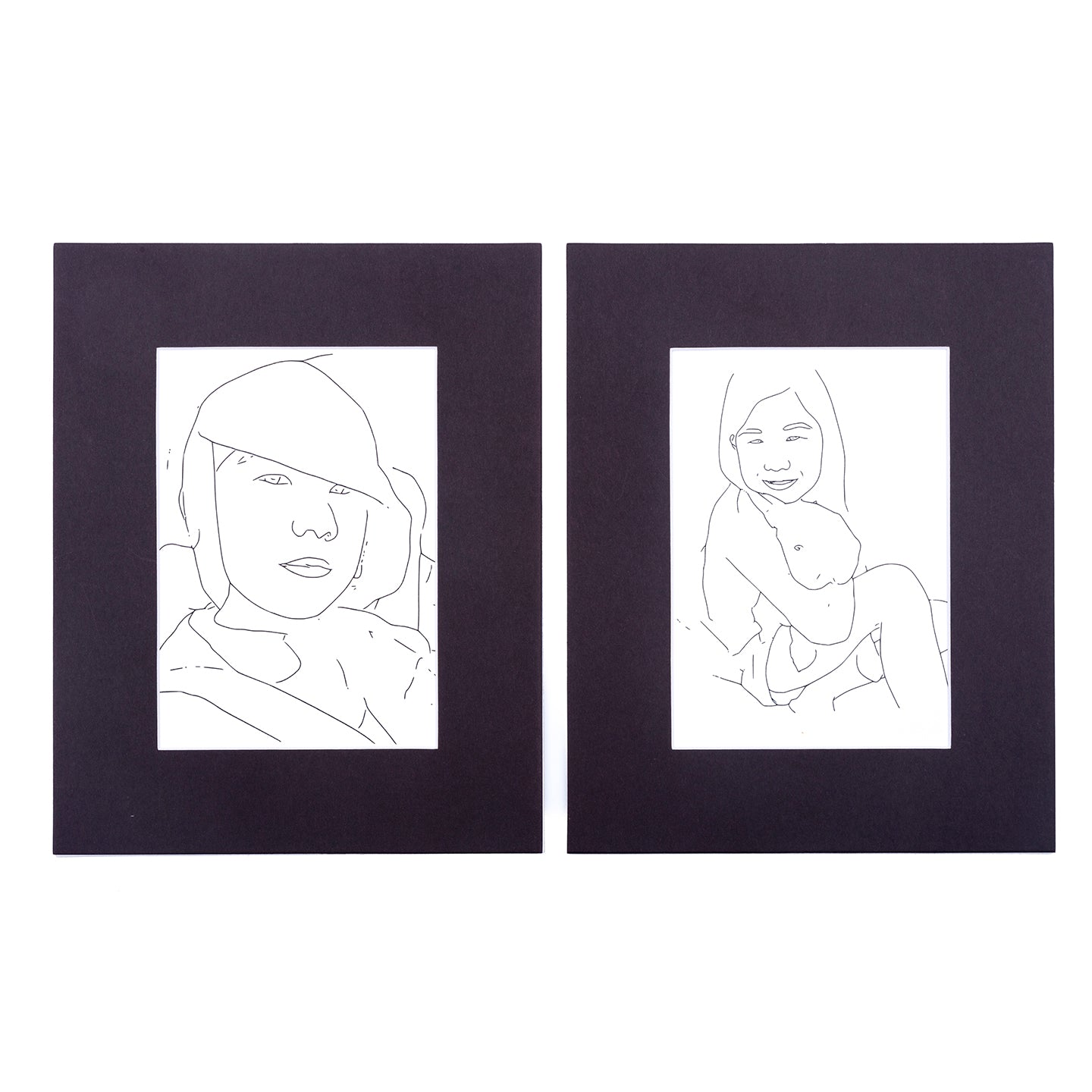 two black matted prints of line drawing with girl from Wonderbook coloring book