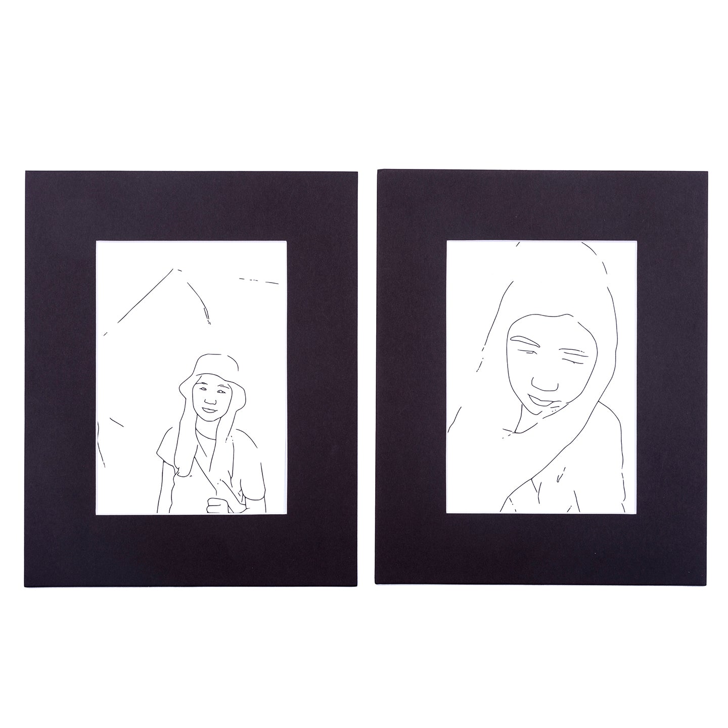 two black matted prints of line drawing with girl from Wonderbook coloring book