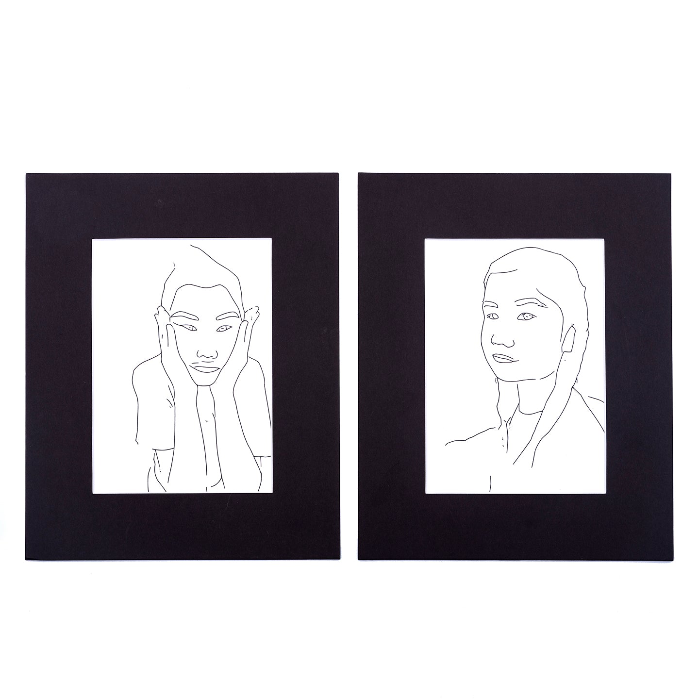 two black matted prints of line drawing with girl from Wonderbook coloring book